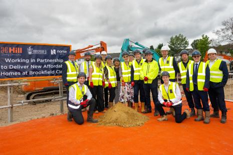 Councillors and officers from Brentwood Borough Council and representatives of The Hill Group and Norse Group, in hi vis jackets and hard hats at the Brookfield Close regeneration scheme